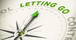 Compass pointing toward the words 'Letting Go', symbolizing the shift from control to surrender and inner peace