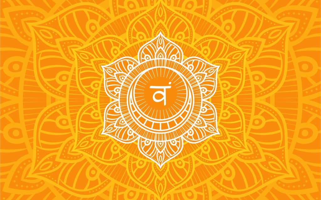 Sacral or svadhistana chakra symbol in orange mandala background representing creativity, pleasure, and emotions